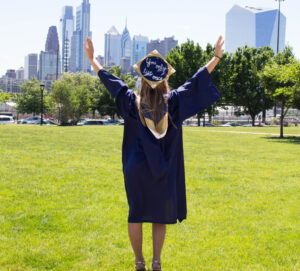 Young lady college graduate spreading her arms