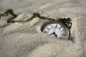 Pocket watch in sand