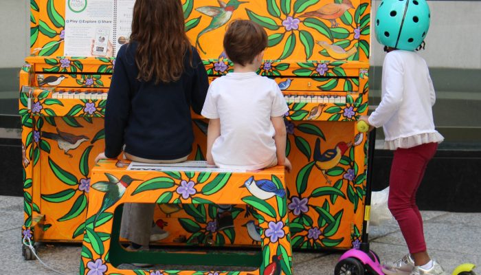 Children playing colorful piano